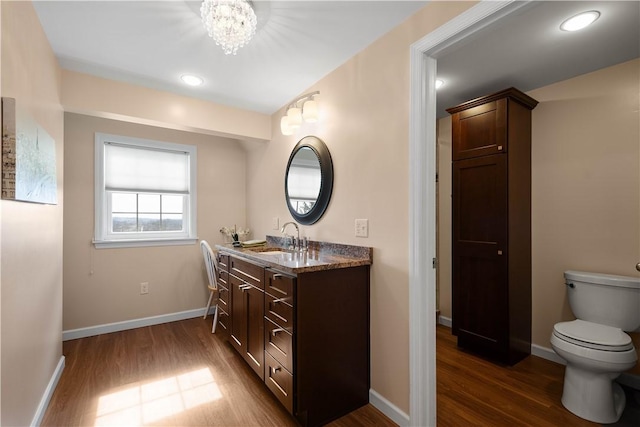 1299 Oakridge Rd, South Fayette, PA 15057 - bathroom featuring vanity, wood finished floors, toilet, and a chandelier