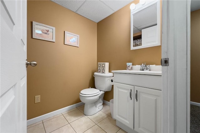 1299 Oakridge Rd, South Fayette, PA 15057 - bathroom with baseboards, vanity, toilet, tile patterned flooring, and a drop ceiling