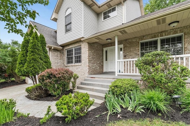 260 Fox Meadow Dr, Pine Twp Nal, PA 15090 - property entrance with brick siding, covered porch, and roof with shingles