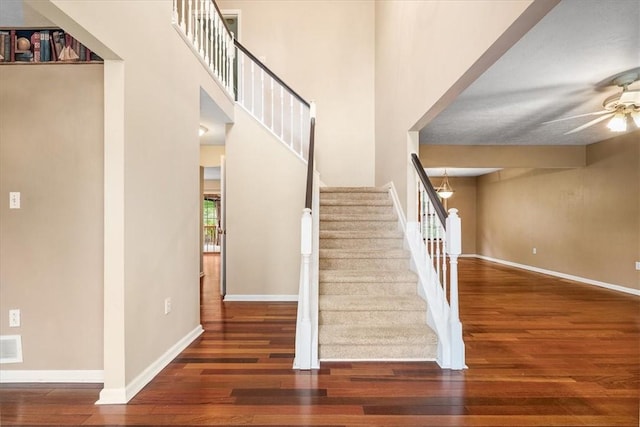 260 Fox Meadow Dr, Pine Twp Nal, PA 15090 - stairway featuring wood finished floors, a ceiling fan, and baseboards