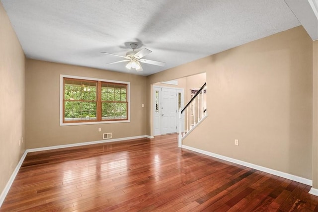 260 Fox Meadow Dr, Pine Twp Nal, PA 15090 - unfurnished room featuring baseboards, ceiling fan, hardwood / wood-style flooring, stairway, and a textured ceiling
