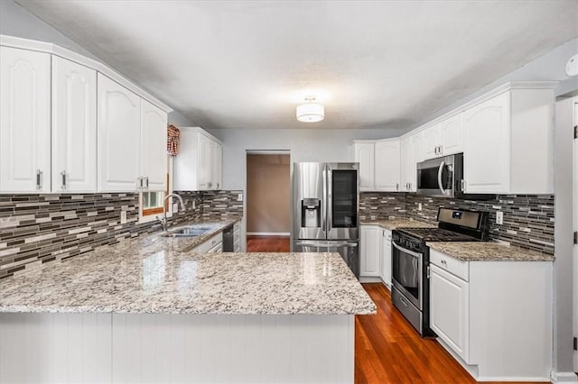 260 Fox Meadow Dr, Pine Twp Nal, PA 15090 - kitchen featuring appliances with stainless steel finishes, a sink, a peninsula, and tasteful backsplash