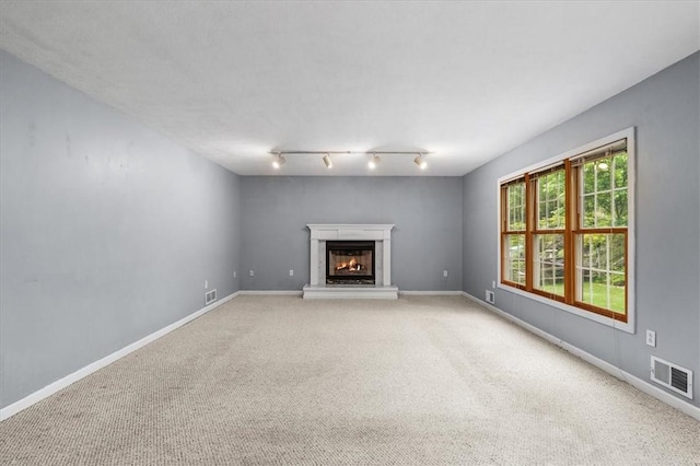 260 Fox Meadow Dr, Pine Twp Nal, PA 15090 - unfurnished living room with a glass covered fireplace, carpet, track lighting, and baseboards