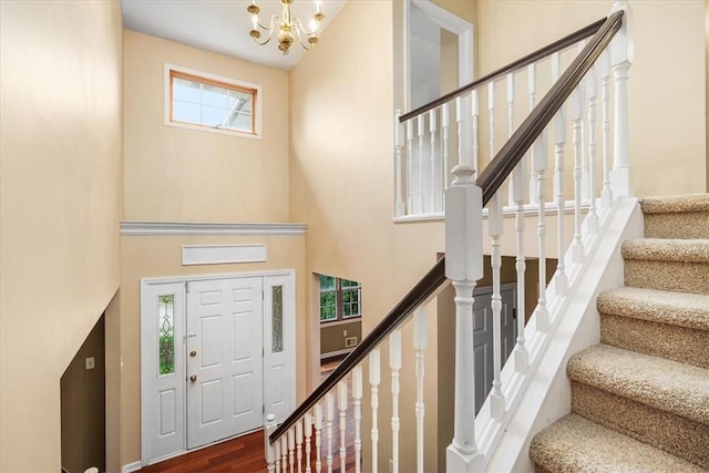 260 Fox Meadow Dr, Pine Twp Nal, PA 15090 - entryway featuring a high ceiling, a chandelier, stairs, and wood finished floors