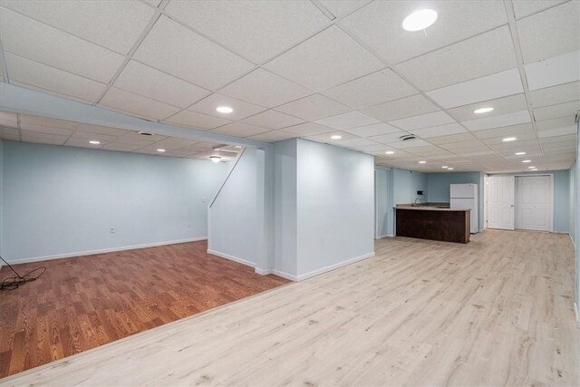 260 Fox Meadow Dr, Pine Twp Nal, PA 15090 - finished below grade area with wood finished floors, freestanding refrigerator, baseboards, and recessed lighting