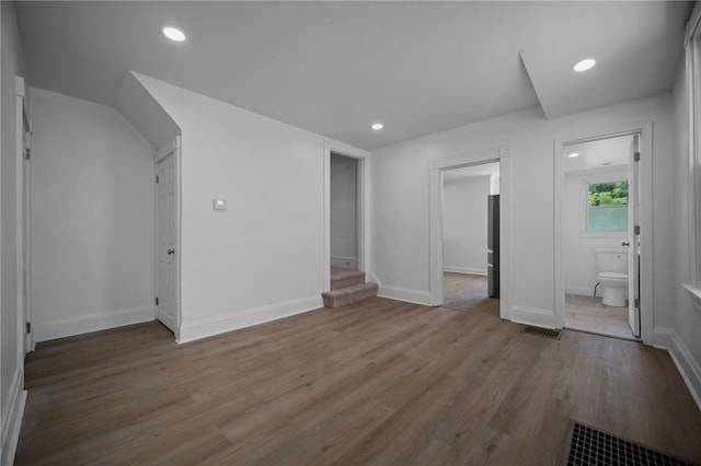 815 W Main St, Carnegie, PA 15106 - unfurnished bedroom with wood finished floors, recessed lighting, baseboards, and connected bathroom