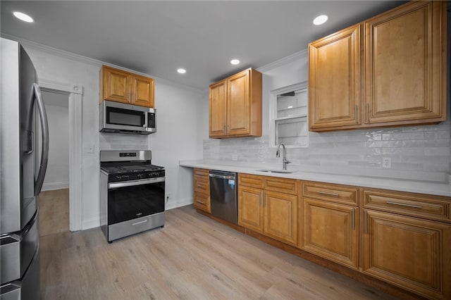 815 W Main St, Carnegie, PA 15106 - kitchen with appliances with stainless steel finishes, crown molding, a sink, light wood finished floors, and tasteful backsplash