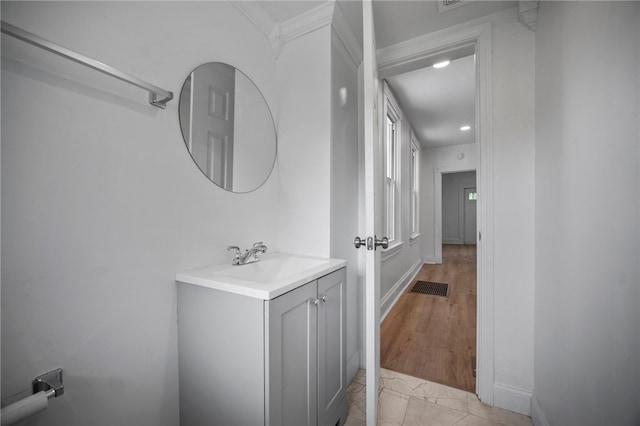 815 W Main St, Carnegie, PA 15106 - bathroom featuring vanity, recessed lighting, baseboards, and crown molding