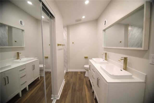 2040 Constitution Blvd, Elizabeth Twp/Boro, PA 15135 - bathroom featuring toilet, double vanity, wood finished floors, and recessed lighting