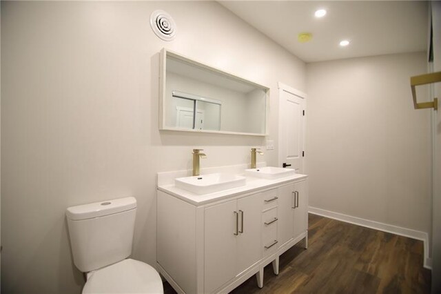 2040 Constitution Blvd, Elizabeth Twp/Boro, PA 15135 - bathroom featuring double vanity, wood finished floors, toilet, recessed lighting, and baseboards