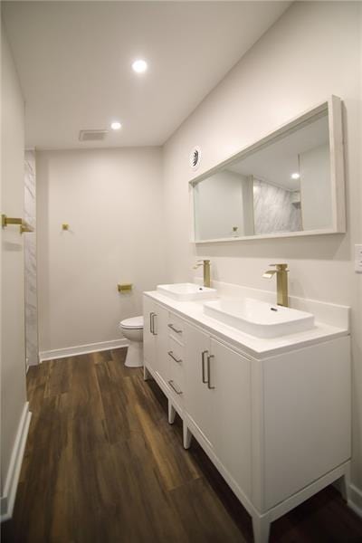 2040 Constitution Blvd, Elizabeth Twp/Boro, PA 15135 - full bath featuring double vanity, wood finished floors, toilet, baseboards, and recessed lighting