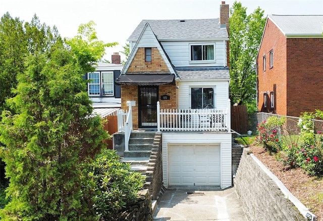 851 Kennebec St, Greenfield, PA 15217 - view of front of home featuring driveway, a shingled roof, a garage, and a chimney