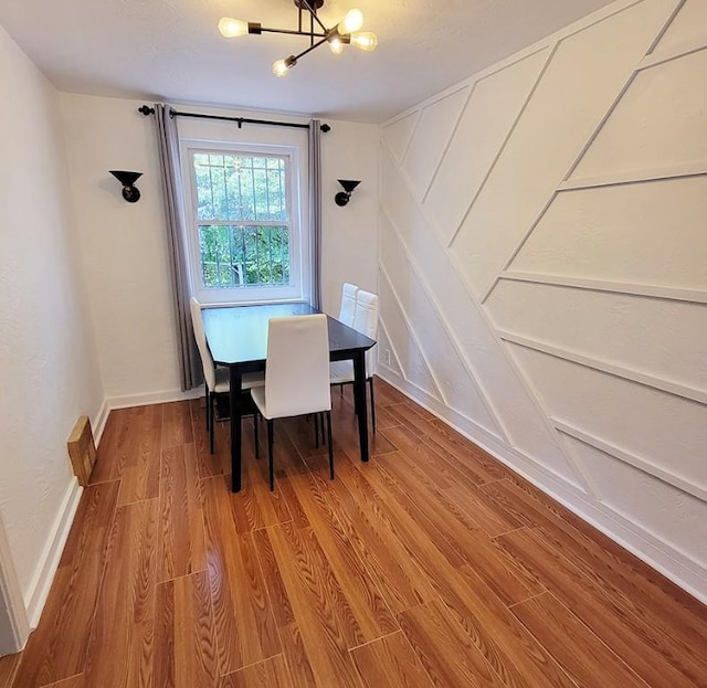 851 Kennebec St, Greenfield, PA 15217 - dining space featuring a chandelier, wood finished floors, and baseboards