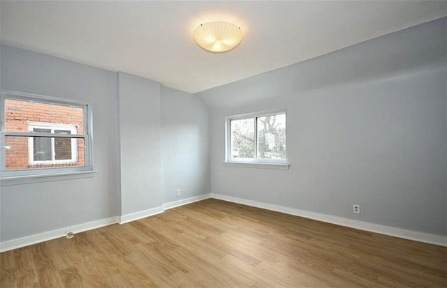 851 Kennebec St, Greenfield, PA 15217 - empty room with light wood finished floors, baseboards, and lofted ceiling