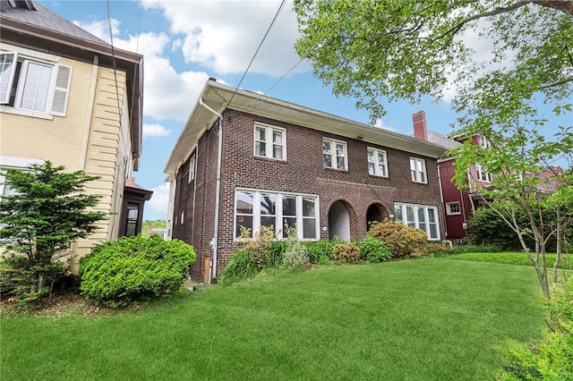 6358 Morrowfield Ave, Squirrel Hill, PA 15217 - view of front of home featuring brick siding, a front lawn, and a chimney