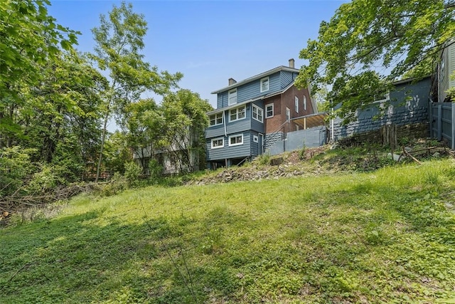8952 Eastwood Rd, Penn Hills, PA 15235 - back of house with a chimney
