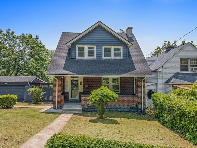 8952 Eastwood Rd, Penn Hills, PA 15235 - bungalow with brick siding, a chimney, roof with shingles, and a porch