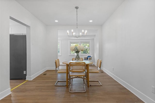 8952 Eastwood Rd, Penn Hills, PA 15235 - dining space with a chandelier, baseboards, wood finished floors, and recessed lighting