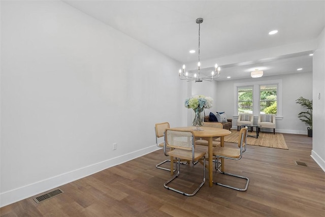 8952 Eastwood Rd, Penn Hills, PA 15235 - dining space with baseboards, recessed lighting, wood finished floors, and a chandelier