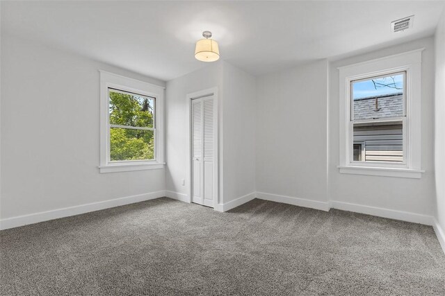 8952 Eastwood Rd, Penn Hills, PA 15235 - carpeted empty room with baseboards
