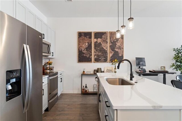 2635 Penn Ave Unit 203, Downtown Pgh, PA 15222 - kitchen featuring stainless steel appliances, a sink, a center island with sink, dark wood-type flooring, and light countertops