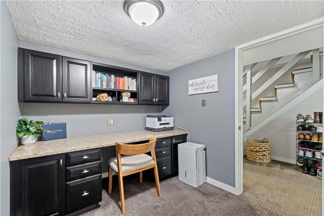503 6th St, Oakmont, PA 15139 - office space with built in desk, light colored carpet, a textured ceiling, and baseboards