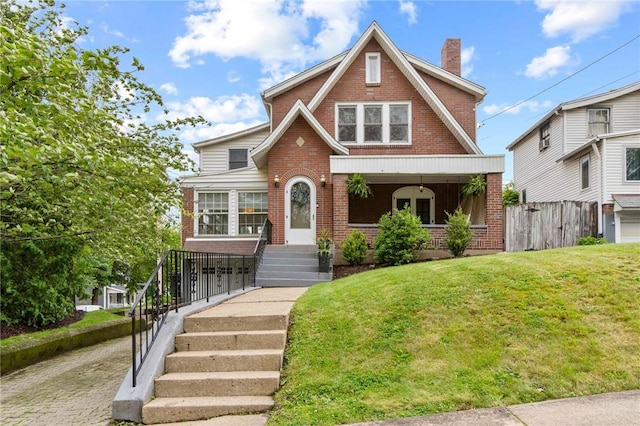 503 6th St, Oakmont, PA 15139 - tudor house with brick siding and a chimney