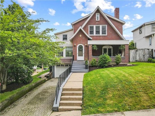 503 6th St, Oakmont, PA 15139 - english style home featuring brick siding, decorative driveway, a garage, a chimney, and a porch
