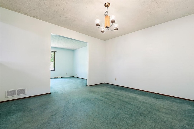 662 Huntington Dr, Cranberry Twp, PA 16066 - empty room with a chandelier, carpet flooring, and a textured ceiling