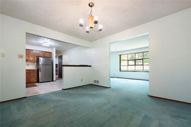 662 Huntington Dr, Cranberry Twp, PA 16066 - unfurnished living room with light carpet, a chandelier, and a textured ceiling