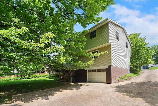 662 Huntington Dr, Cranberry Twp, PA 16066 - view of side of home with an attached garage, driveway, and stairway