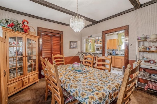 306 Meadow Ave, Charleroi Boro, PA 15022 - dining space featuring dark colored carpet, beamed ceiling, a chandelier, and wallpapered walls