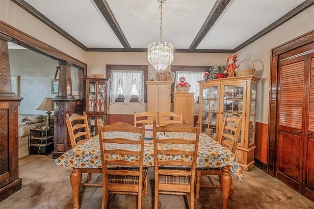 306 Meadow Ave, Charleroi Boro, PA 15022 - carpeted dining area featuring a chandelier and beamed ceiling