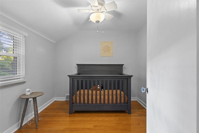 752 Washington, Ross Twp, PA 15229 - bedroom featuring wood finished floors, lofted ceiling, baseboards, a crib, and ceiling fan