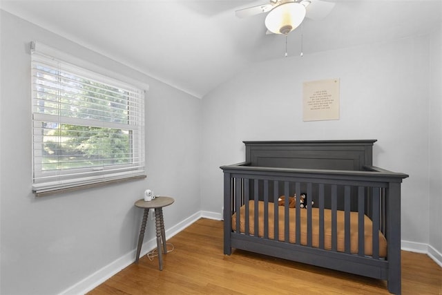 752 Washington, Ross Twp, PA 15229 - bedroom featuring wood finished floors, baseboards, lofted ceiling, ceiling fan, and a crib