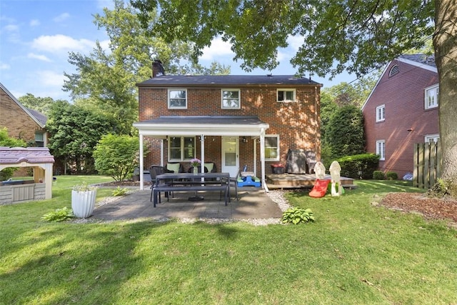 752 Washington, Ross Twp, PA 15229 - back of property featuring brick siding, a chimney, a patio, and a yard