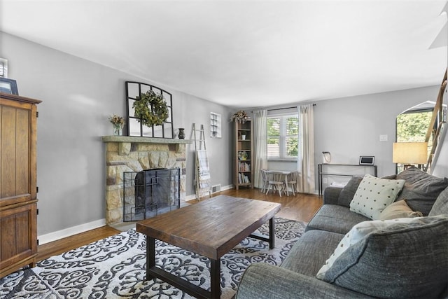 752 Washington, Ross Twp, PA 15229 - living room with a fireplace, baseboards, and wood finished floors