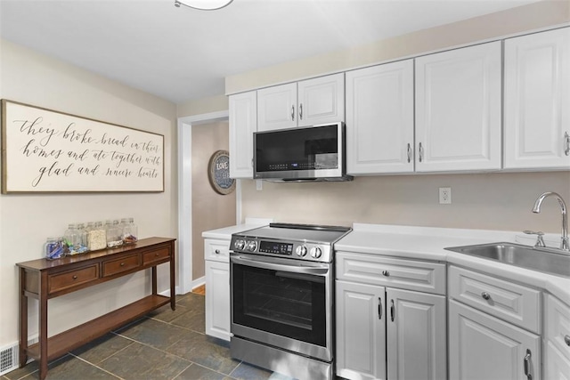 752 Washington, Ross Twp, PA 15229 - kitchen featuring stainless steel appliances, a sink, white cabinetry, and light countertops