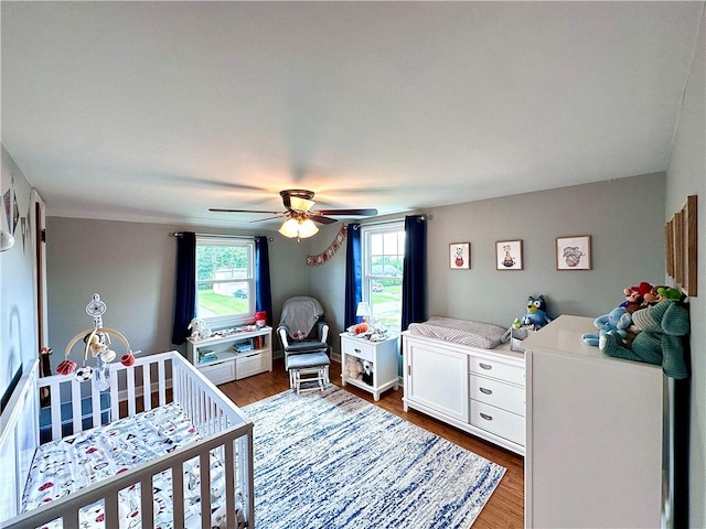 104 Kenneth Ave, Neshannock Twp, PA 16105 - bedroom featuring wood finished floors, a crib, and ceiling fan