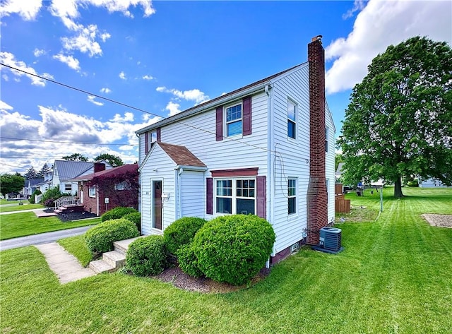 104 Kenneth Ave, Neshannock Twp, PA 16105 - view of side of home featuring a chimney, a yard, and central AC