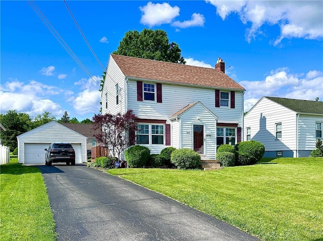 104 Kenneth Ave, Neshannock Twp, PA 16105 - view of front facade featuring a chimney, a detached garage, an outbuilding, and a front yard