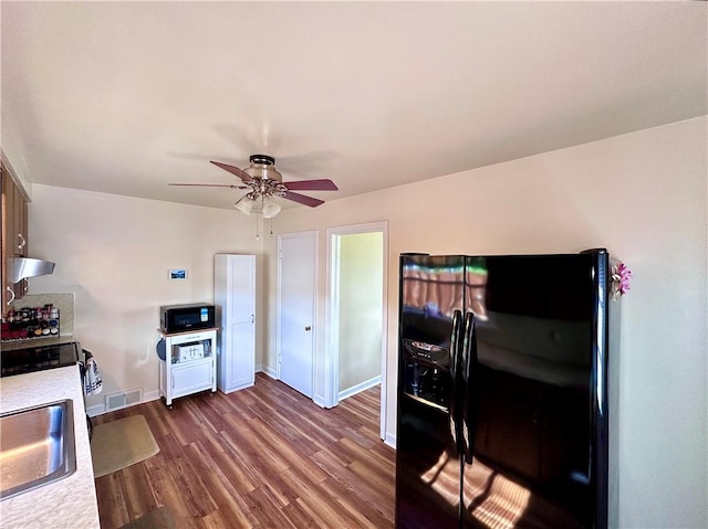 104 Kenneth Ave, Neshannock Twp, PA 16105 - kitchen featuring black appliances, a ceiling fan, dark wood-type flooring, light countertops, and a sink
