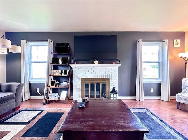 104 Kenneth Ave, Neshannock Twp, PA 16105 - living area with healthy amount of natural light, wood finished floors, baseboards, and a fireplace