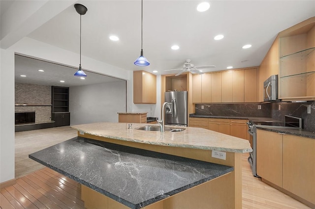 1648 Little Meadow Rd, Upper St Clair, PA 15241 - kitchen featuring stainless steel appliances, a sink, light wood-style floors, dark stone counters, and recessed lighting