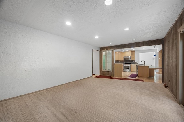 1648 Little Meadow Rd, Upper St Clair, PA 15241 - unfurnished living room with a textured ceiling, a sink, recessed lighting, a textured wall, and baseboards