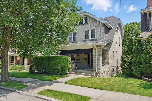 1150 Morningside Ave, Morningside, PA 15206 - view of front facade with a porch, brick siding, and a front lawn