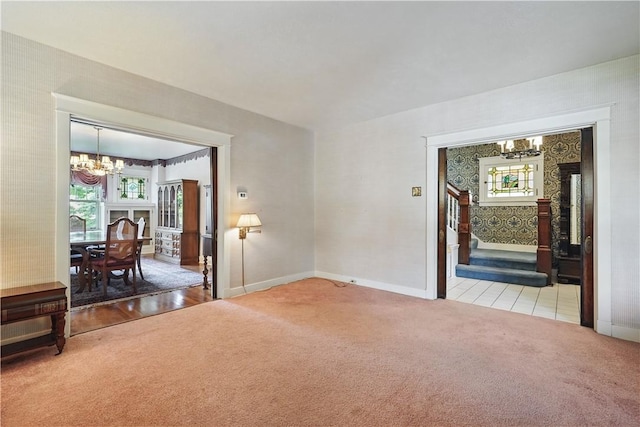 1150 Morningside Ave, Morningside, PA 15206 - empty room featuring a chandelier, light colored carpet, baseboards, and healthy amount of natural light