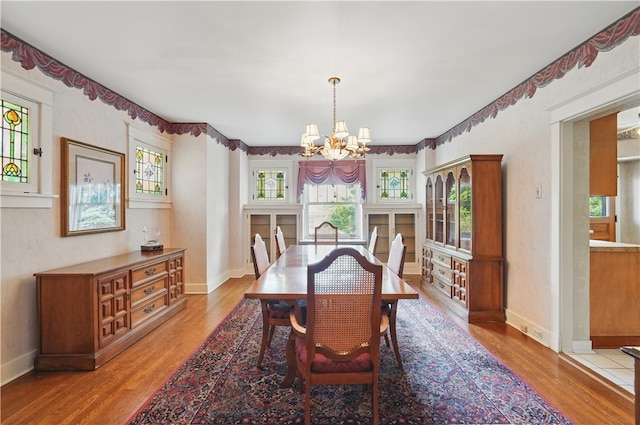 1150 Morningside Ave, Morningside, PA 15206 - dining space with a chandelier, light wood-style flooring, and baseboards
