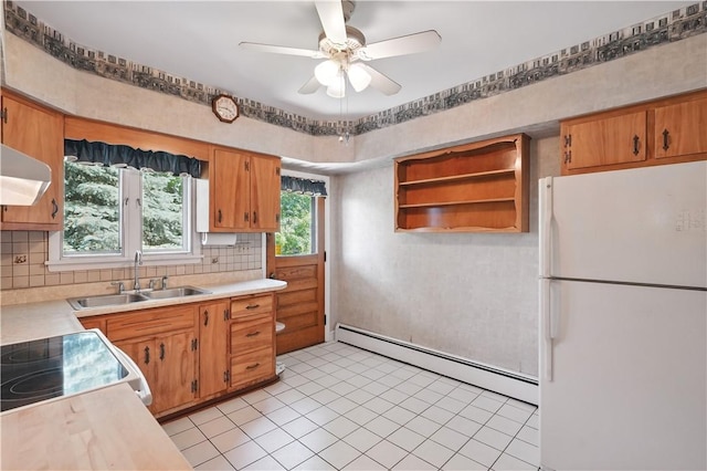 1150 Morningside Ave, Morningside, PA 15206 - kitchen with freestanding refrigerator, a baseboard radiator, a sink, light countertops, and extractor fan