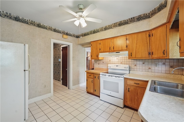 1150 Morningside Ave, Morningside, PA 15206 - kitchen featuring white appliances, under cabinet range hood, a sink, a ceiling fan, and light countertops